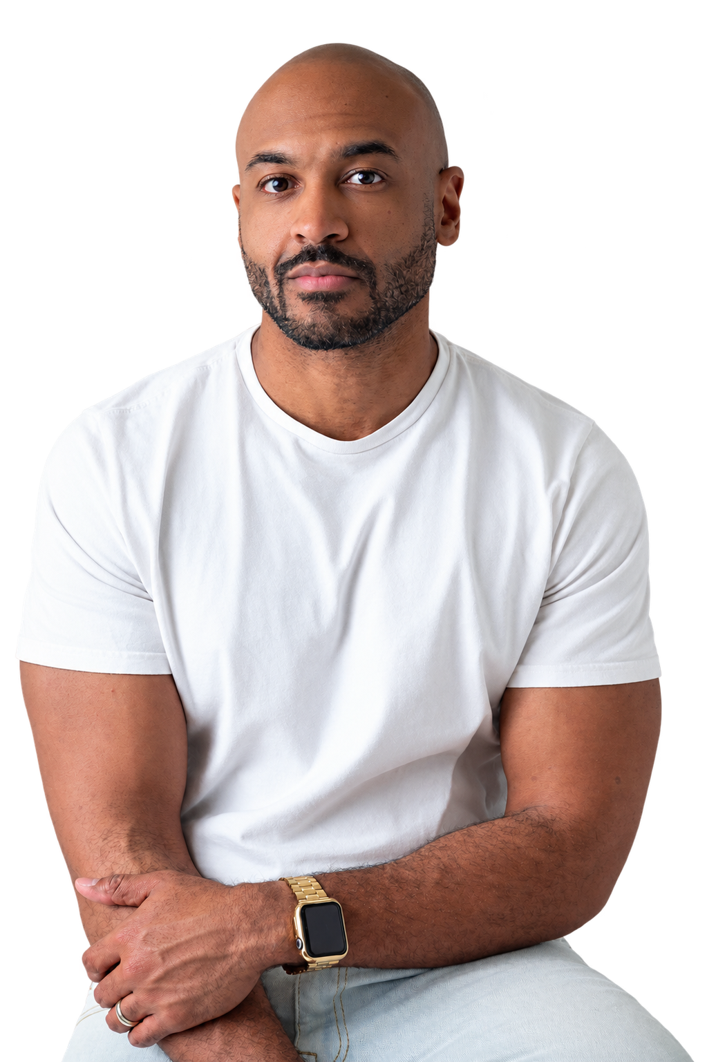 Preston Mynatt wearing a white shirt with his arms folded